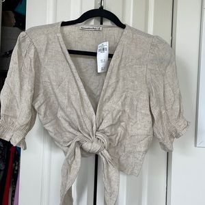 Beige front tie top.
